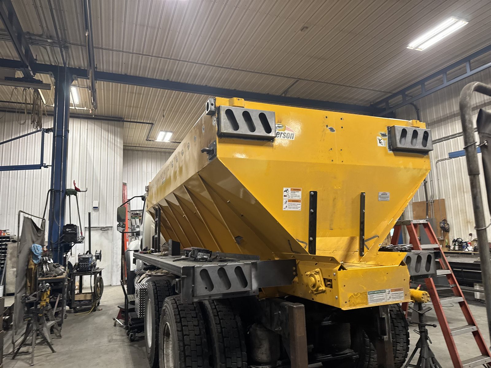 Yellow sander/spreader unit built by RAD Industrial & Fleet
